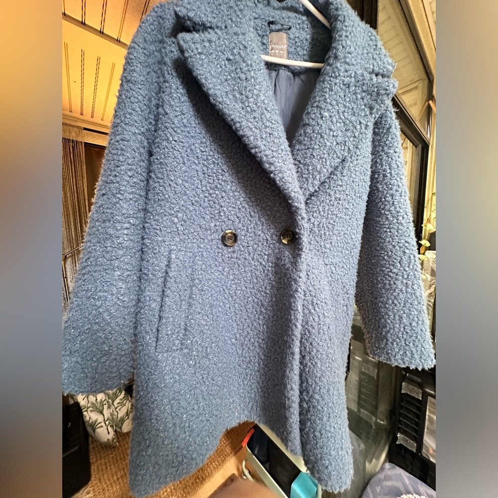 Fluffy bouclè mid blue coat.